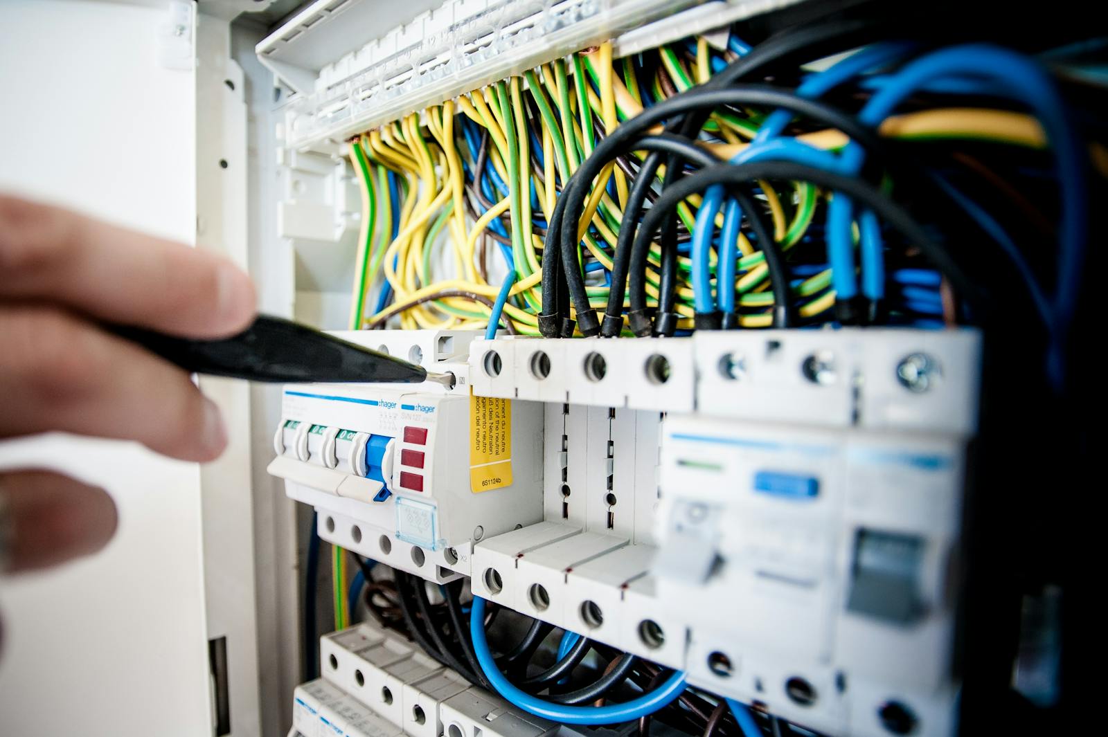 Open electrical service panel with neatly arranged circuit breakers and wiring